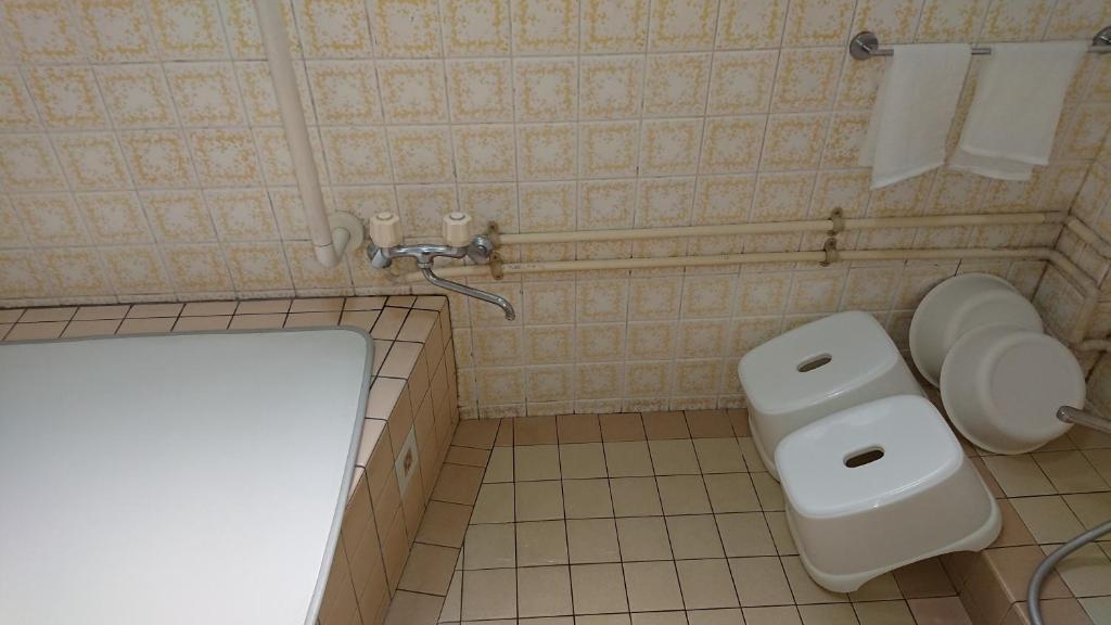 Koupelna v ubytování Kasuga Ryokan