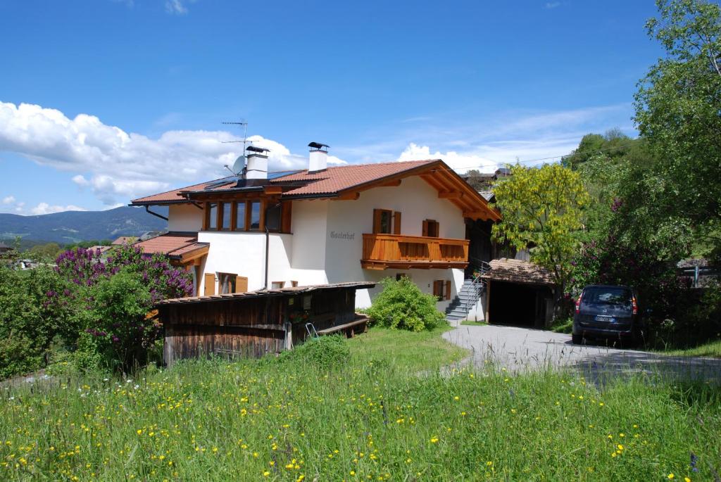 a house with a car parked in front of it at Appartment Gsolerhof in Castelrotto