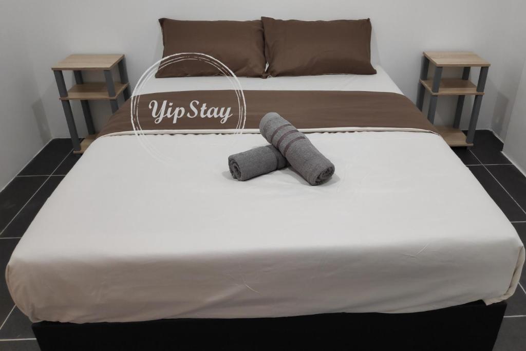 Postel nebo postele na pokoji v ubytování YipStay