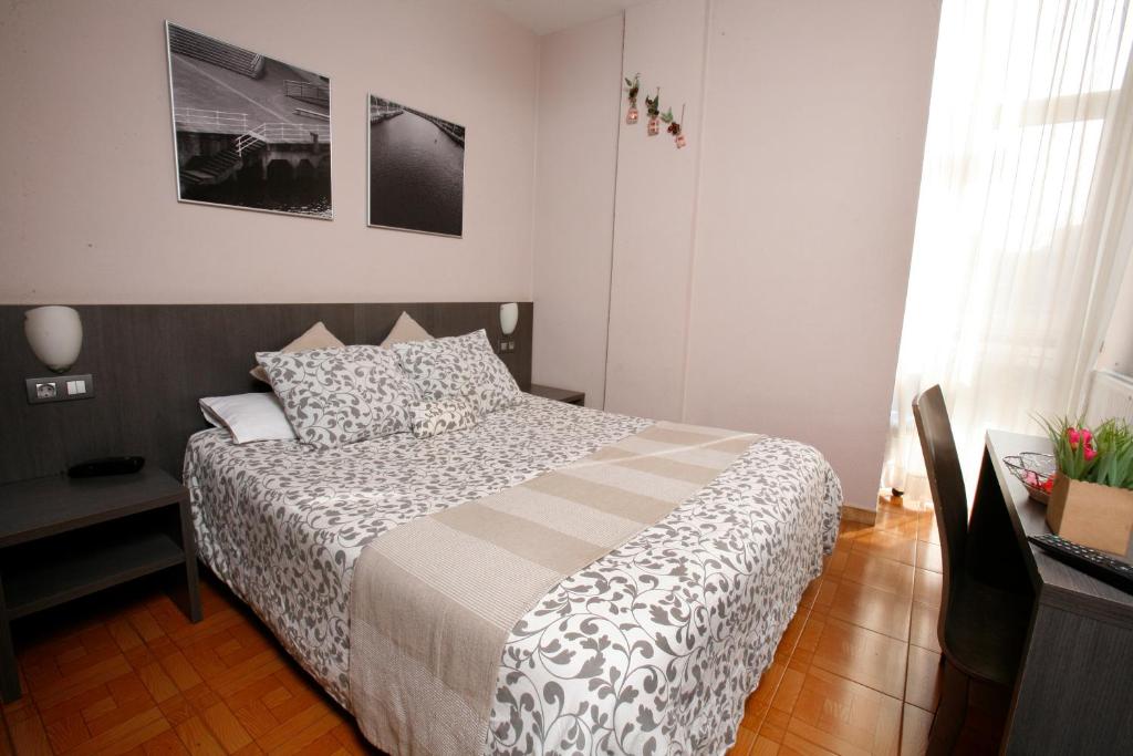 Postel nebo postele na pokoji v ubytování Hotel Ripa