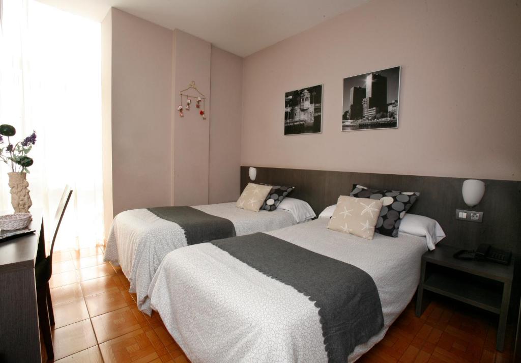 Postel nebo postele na pokoji v ubytování Hotel Ripa