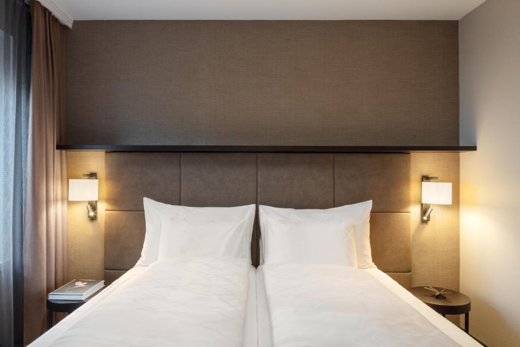 Voodi või voodid majutusasutuse Hotel Victoria toas