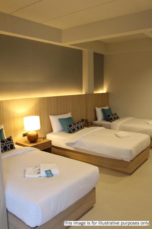 Postel nebo postele na pokoji v ubytování Rajthani Hotel - SHA Certified