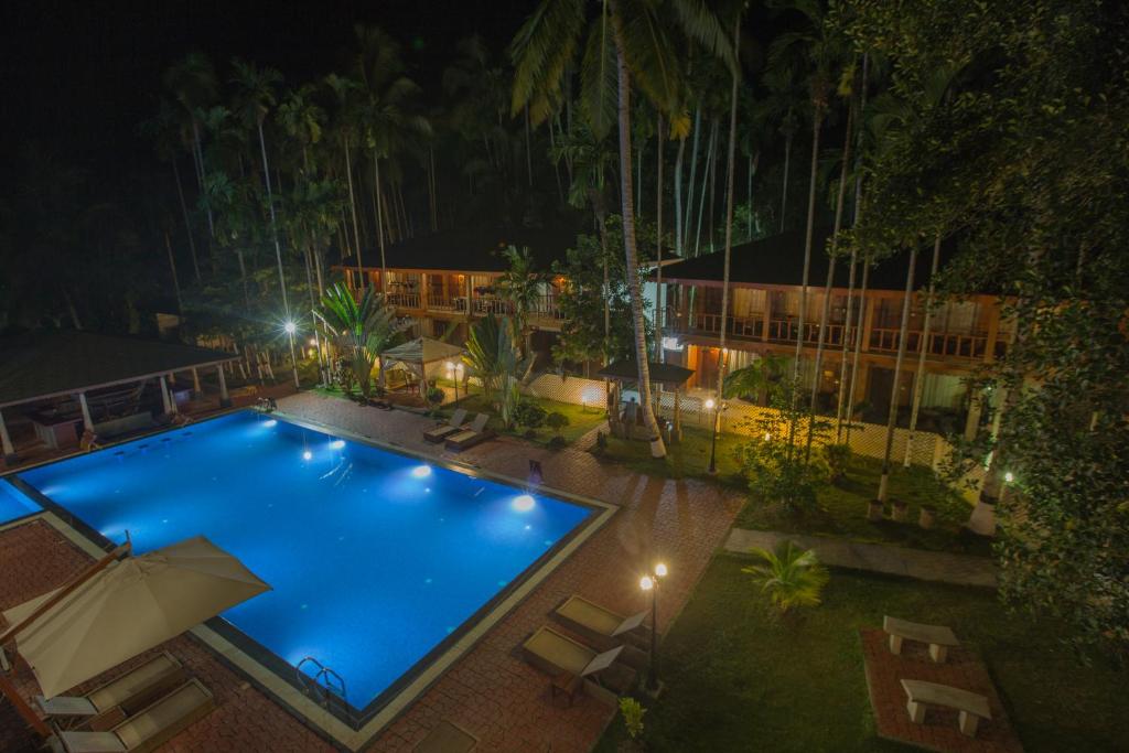 an overhead view of a swimming pool at night at TSG Blue Resort & Spa in Havelock Island