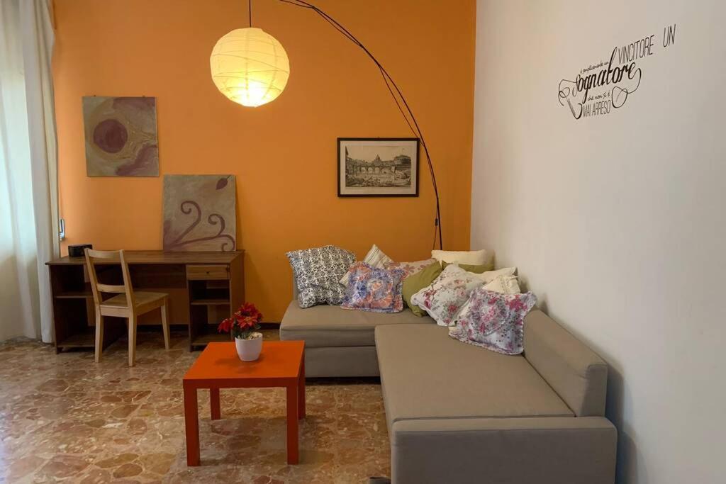 a living room with a couch and a table at A casa da Claudio in Parma