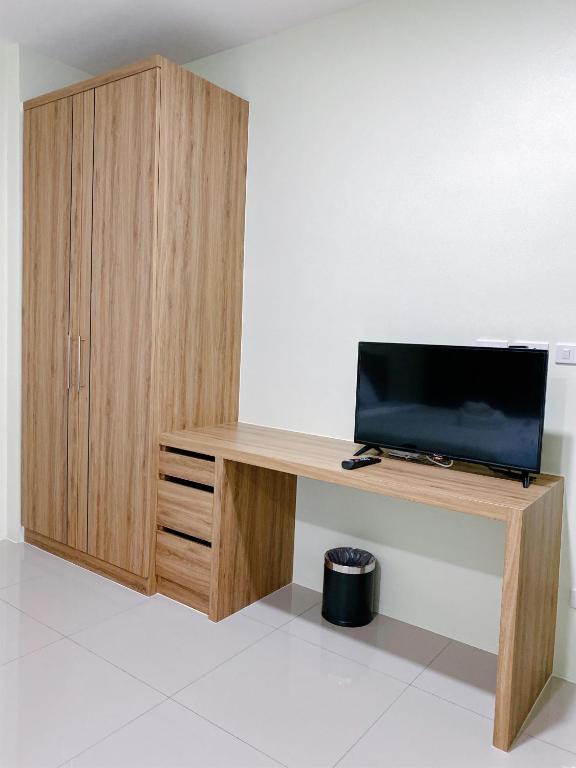 TV a/nebo společenská místnost v ubytování Nai Yang Residence