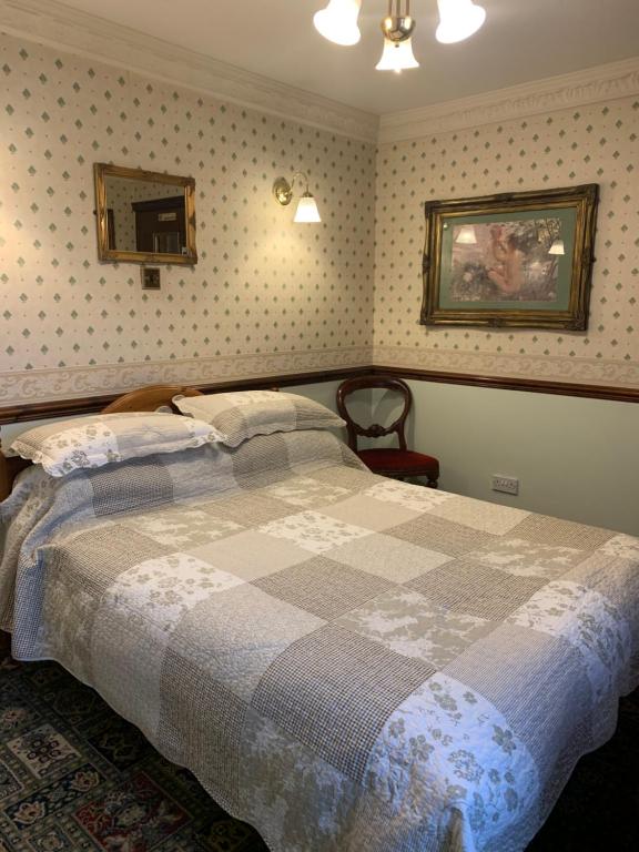 Postel nebo postele na pokoji v ubytování Lyndon House