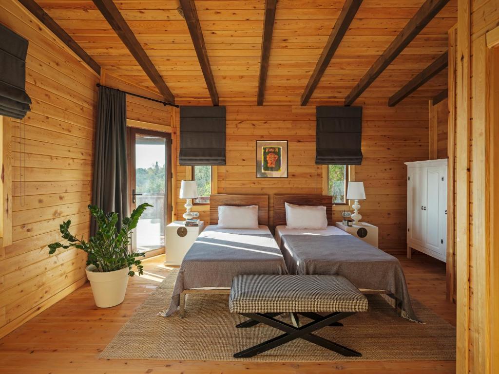 Postel nebo postele na pokoji v ubytování Simurg Inn