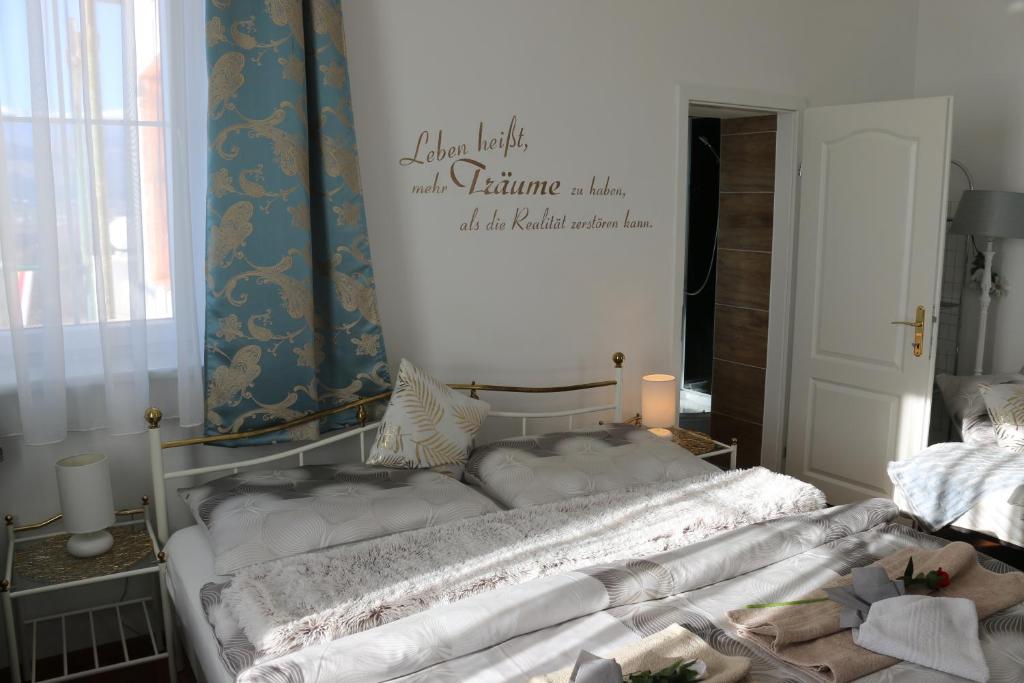 Postel nebo postele na pokoji v ubytování Villa Schloss