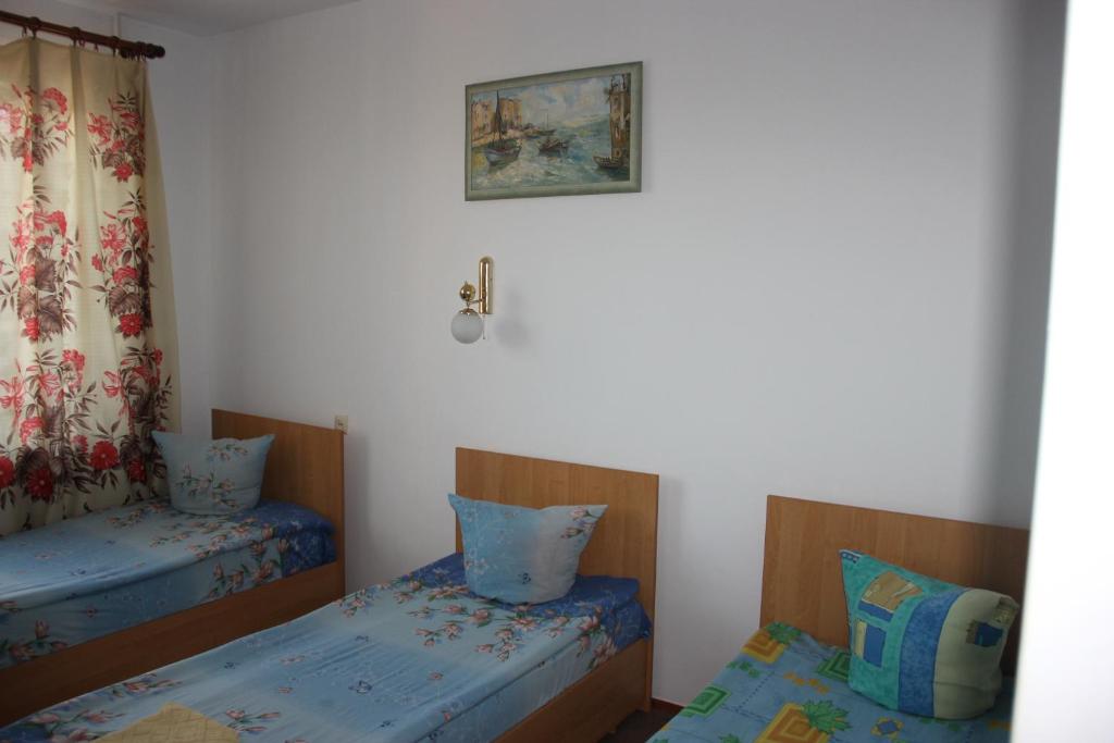 Postel nebo postele na pokoji v ubytování Hotel - restaurant "Lion's heart"