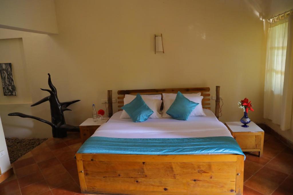 Postel nebo postele na pokoji v ubytování Pranavam Resort & Spa