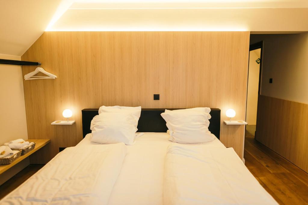 Postel nebo postele na pokoji v ubytování Guesthouse De Casteleer