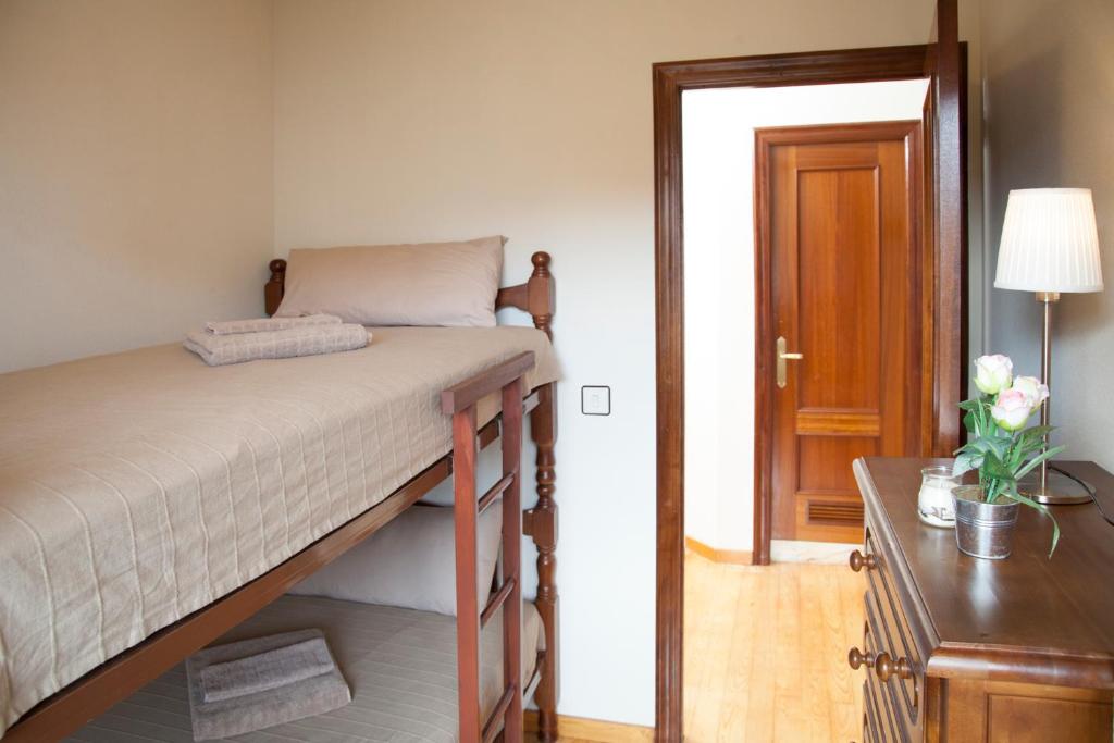 A bed or beds in a room at El Puerto