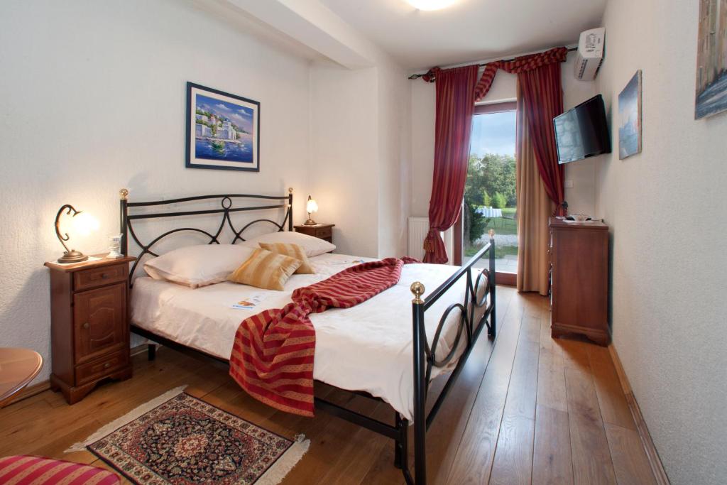 Postel nebo postele na pokoji v ubytování Villa Castello Rausch