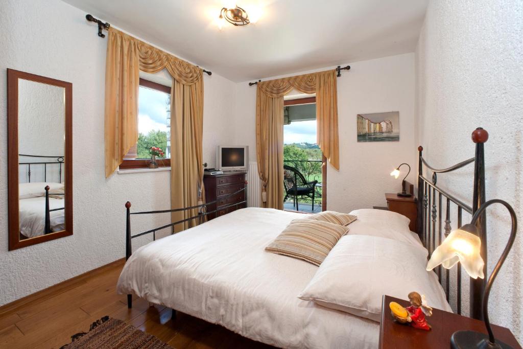 Postel nebo postele na pokoji v ubytování Villa Castello Rausch