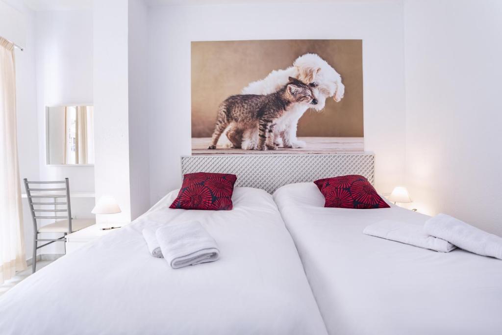 Posteľ alebo postele v izbe v ubytovaní Rentcostadelsol Malagueta Arenal