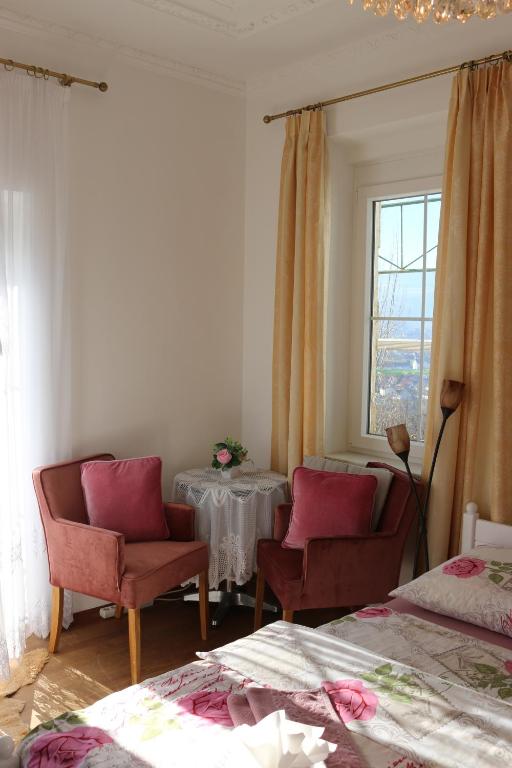 Postel nebo postele na pokoji v ubytování Villa Schloss