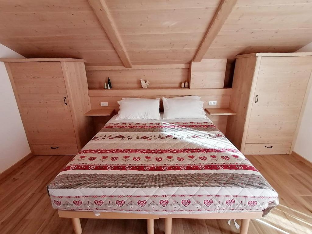 Postel nebo postele na pokoji v ubytování Ai Larici