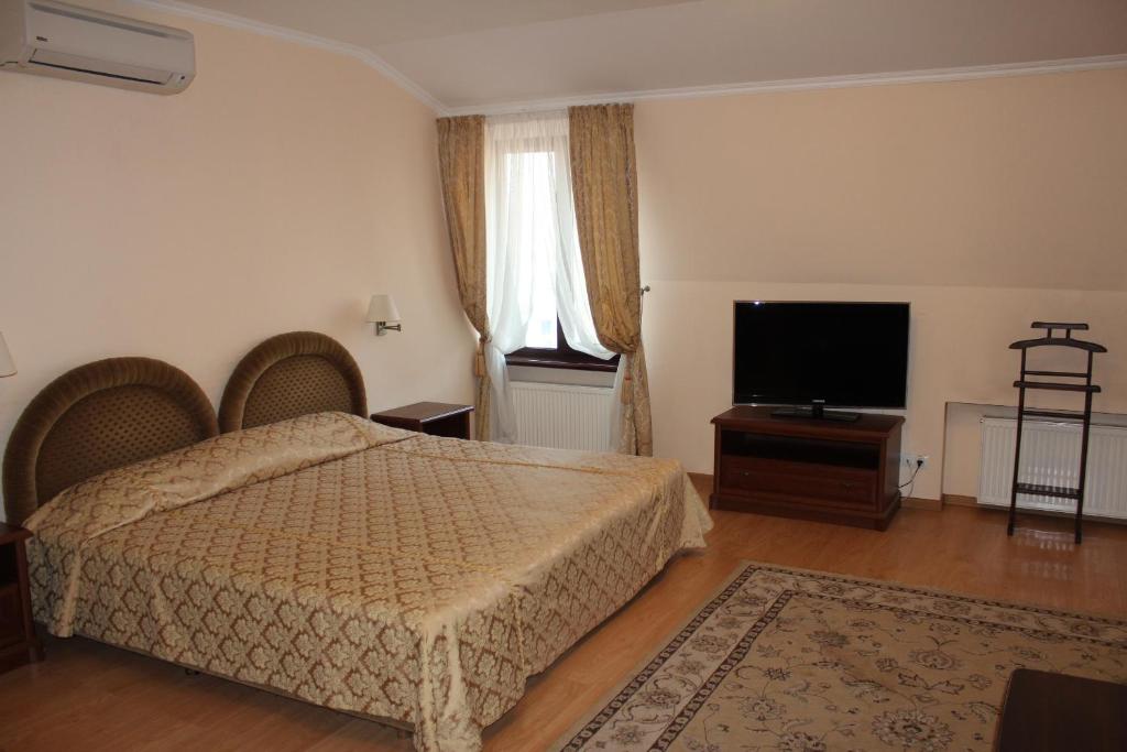 Postel nebo postele na pokoji v ubytování Domus Hotel-1
