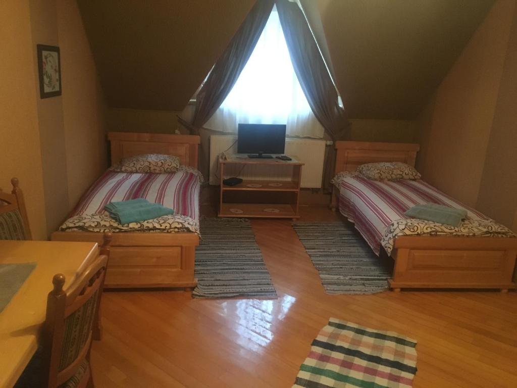 Postel nebo postele na pokoji v ubytování Hotel Svitlytsia