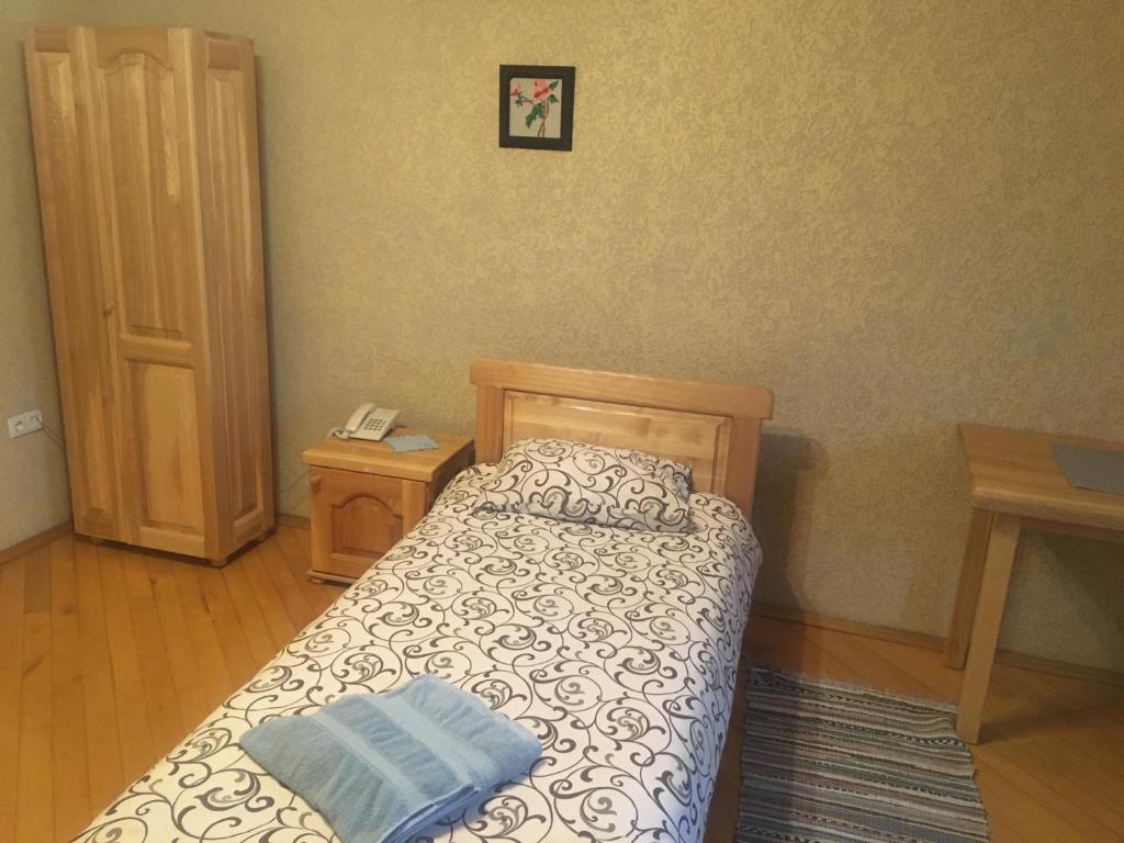 Postel nebo postele na pokoji v ubytování Hotel Svitlytsia