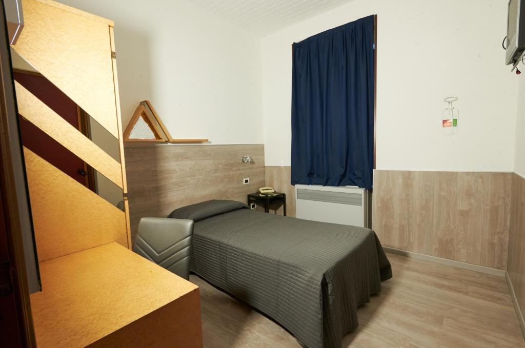 Postel nebo postele na pokoji v ubytování Hotel Atlantic