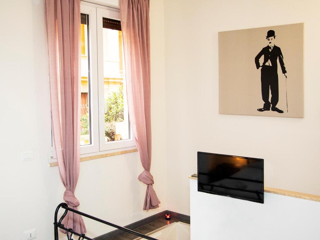 Televízia a/alebo spoločenská miestnosť v ubytovaní San Pietro apart
