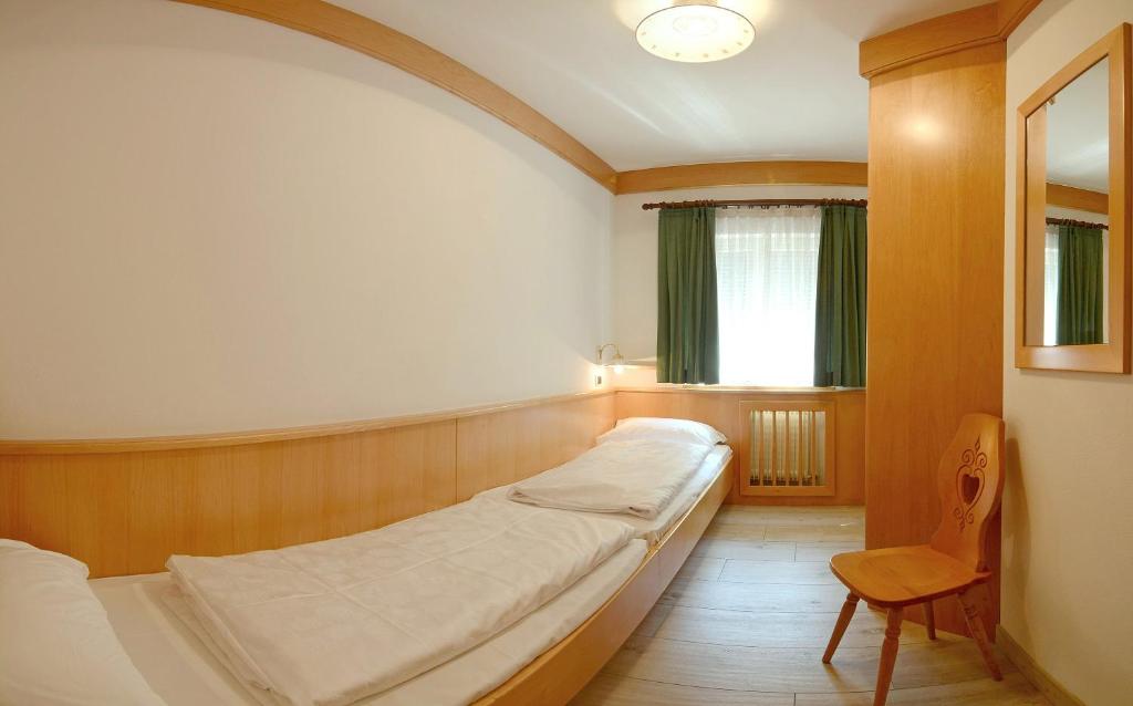 Łóżko lub łóżka w pokoju w obiekcie Casa Roder by Garni Snaltnerhof