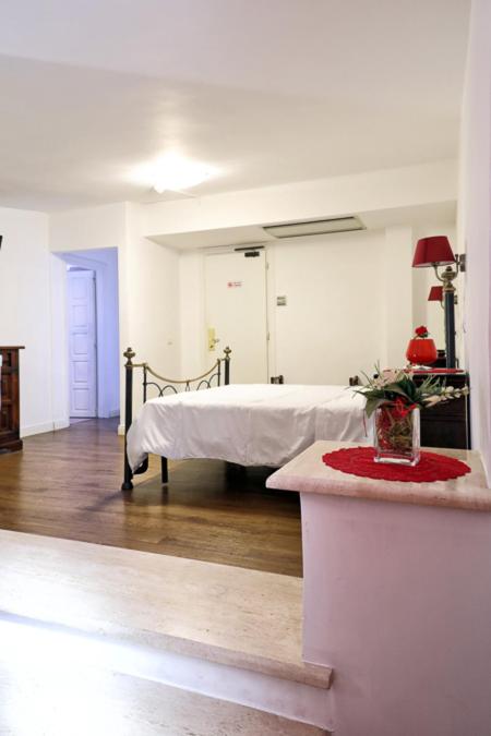 Postel nebo postele na pokoji v ubytování Hotel Al Castello