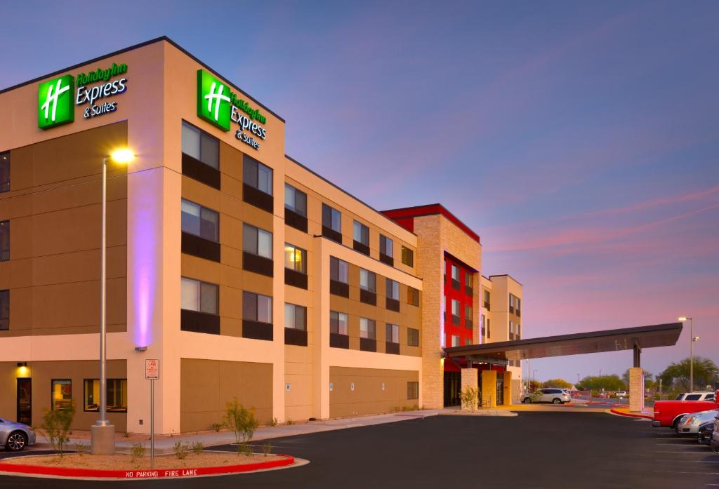 a hotel building with a gas station in a parking lot at Holiday Inn Express & Suites Phoenix West - Buckeye, an IHG Hotel in Buckeye