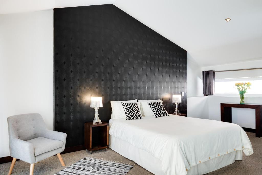 Postel nebo postele na pokoji v ubytování Hotel Casa Gardenia