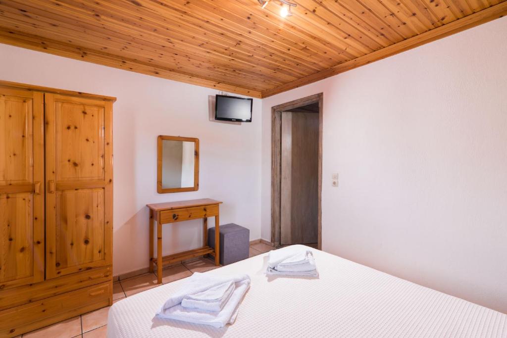 Postel nebo postele na pokoji v ubytování Archodissa Pansion