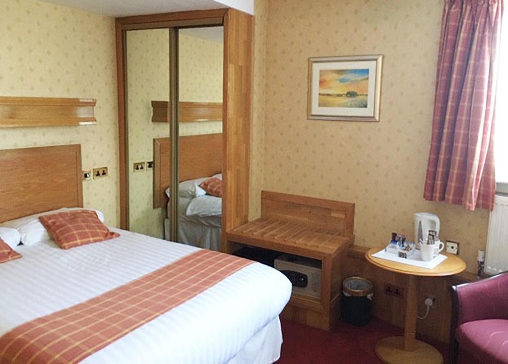 Postel nebo postele na pokoji v ubytování Leapark Hotel