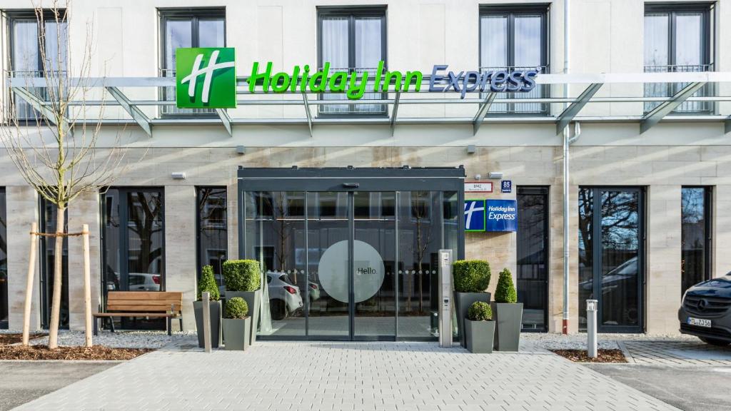 a building with a sign on the front of it at Holiday Inn Express Munich - City East, an IHG Hotel in Munich