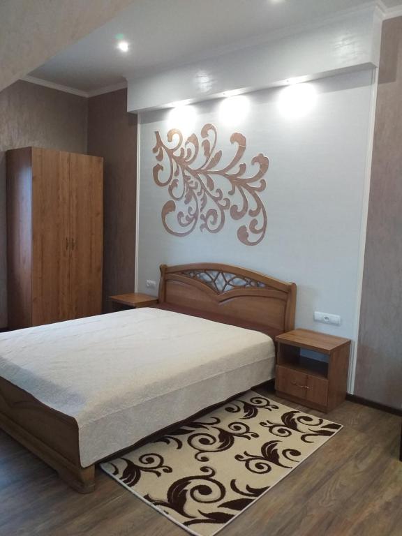 Postel nebo postele na pokoji v ubytování Усадьба " У Артура"
