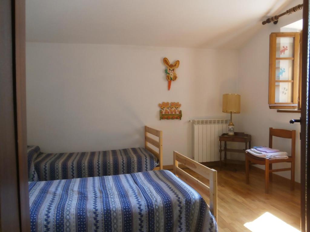 Postel nebo postele na pokoji v ubytování Lucignolo