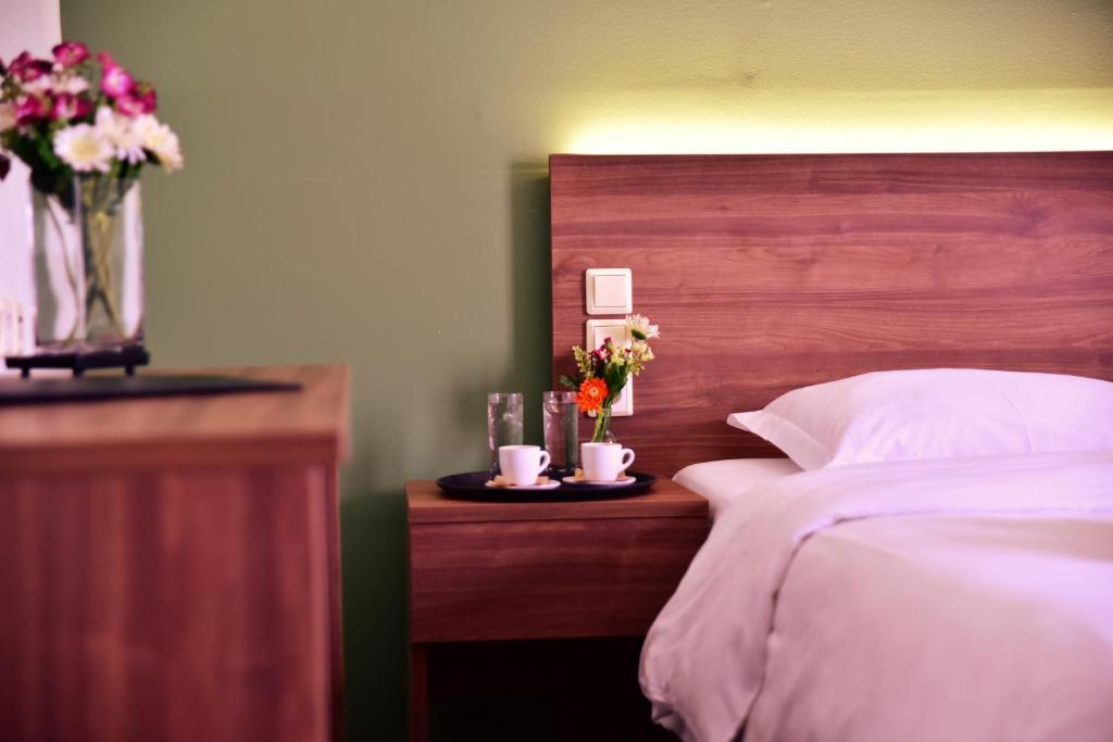 Postel nebo postele na pokoji v ubytování Mont Helmos Hotel