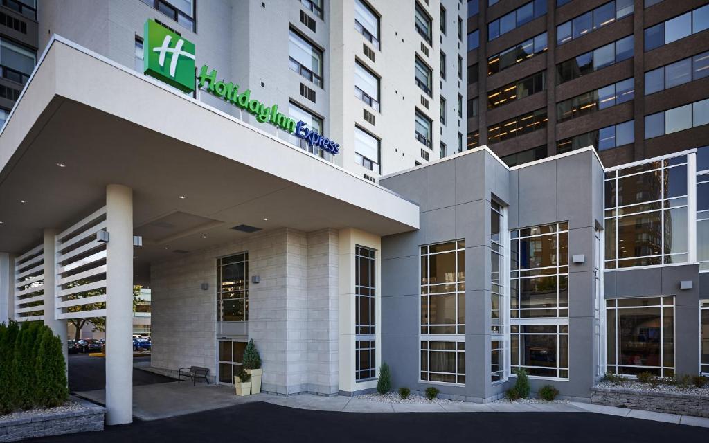 a hospital building with a sign on top of it at Holiday Inn Express Windsor Waterfront, an IHG Hotel in Windsor