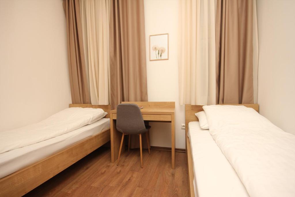 Postel nebo postele na pokoji v ubytování Vila Alexandra