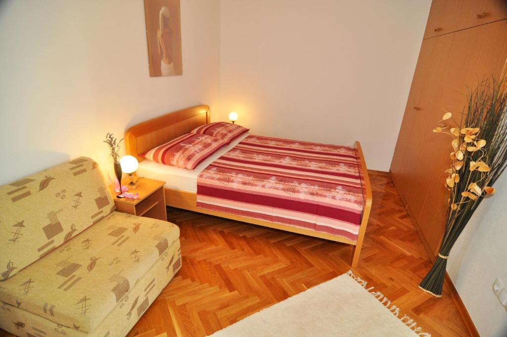 Postel nebo postele na pokoji v ubytování Apartmani Rokić