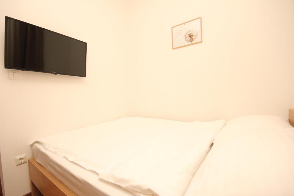 Postel nebo postele na pokoji v ubytování Vila Alexandra