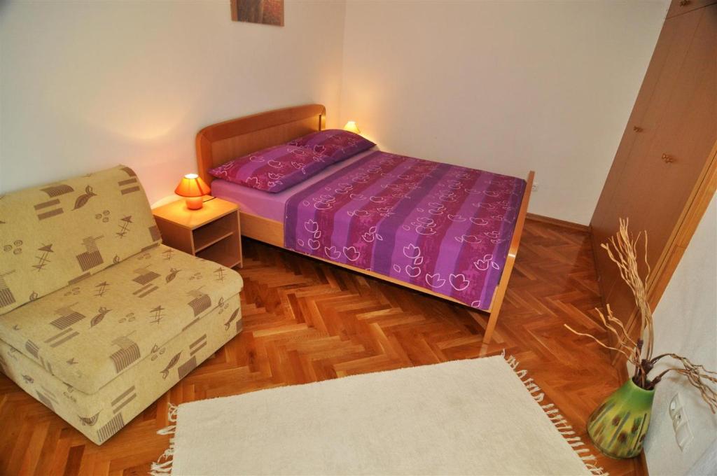 Postel nebo postele na pokoji v ubytování Apartmani Rokić