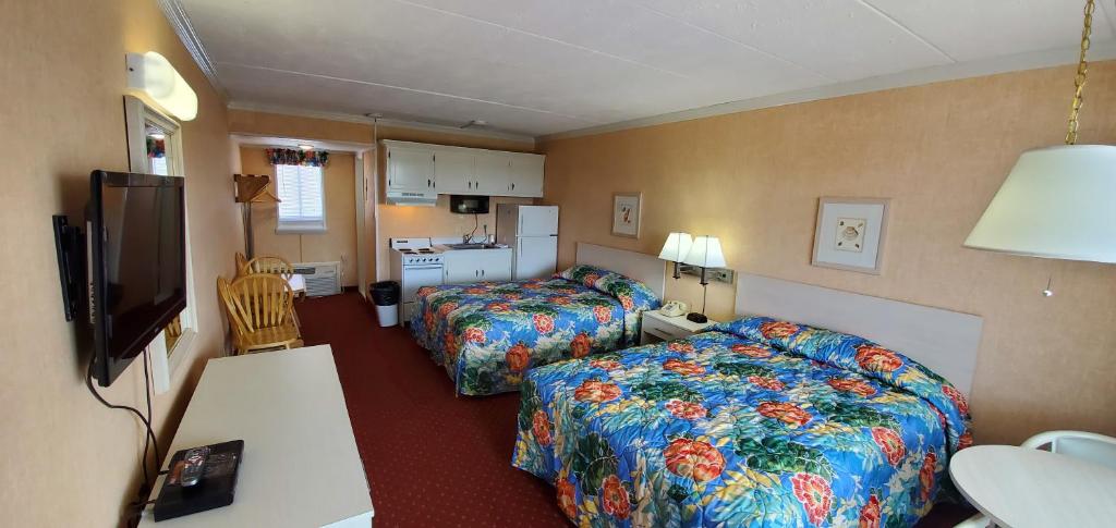 Ein Bett oder Betten in einem Zimmer der Unterkunft Shangri-La Motel