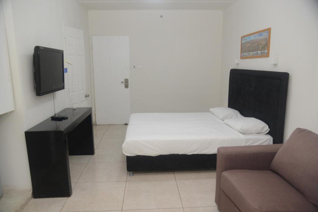 TV a/nebo společenská místnost v ubytování Hotel Maman