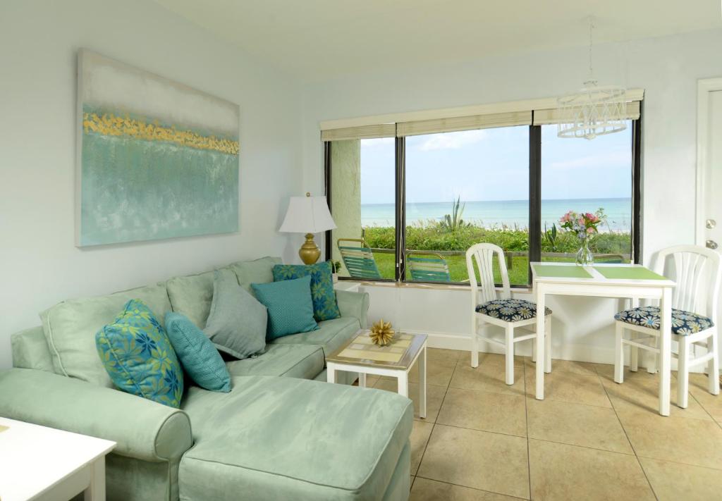 a living room with a couch and a table at Tuckaway Shores Resort in Melbourne