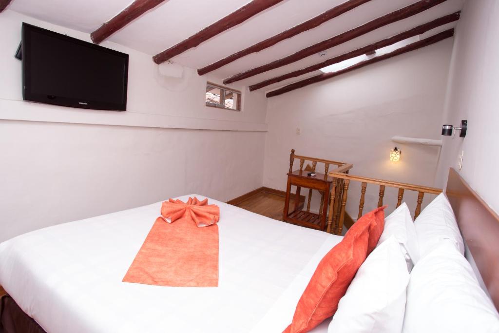 Postel nebo postele na pokoji v ubytování Hotel Arcangel