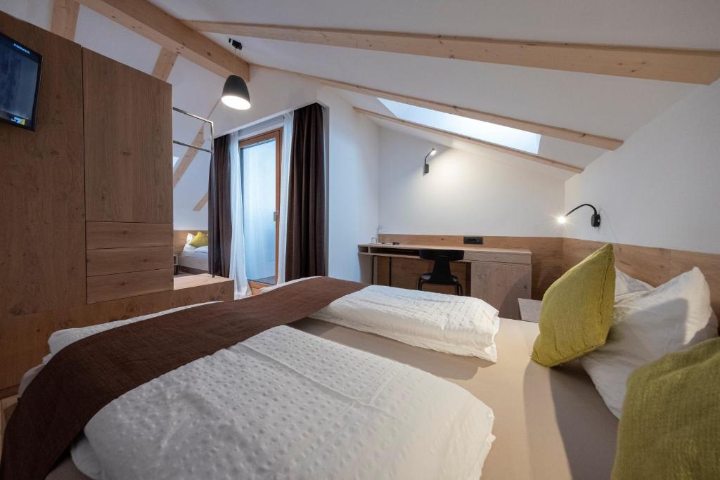 Postel nebo postele na pokoji v ubytování Active Hotel Rosat
