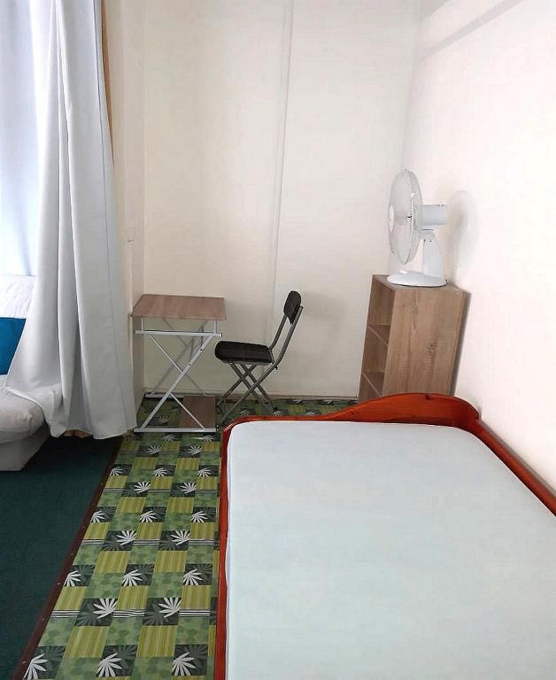 Postel nebo postele na pokoji v ubytování Le Colibri, vue exceptionnelle sur la Soufrière