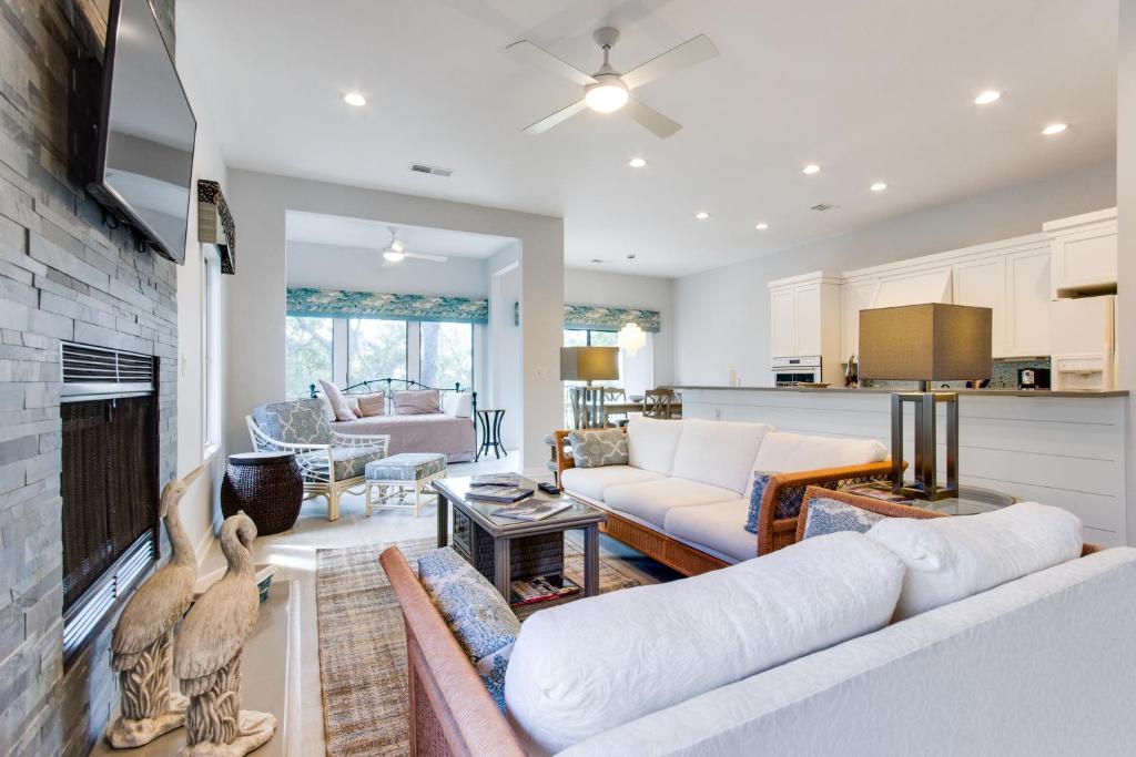 a living room with a couch and a fireplace at Ocean Winds 3023 in Seabrook Island