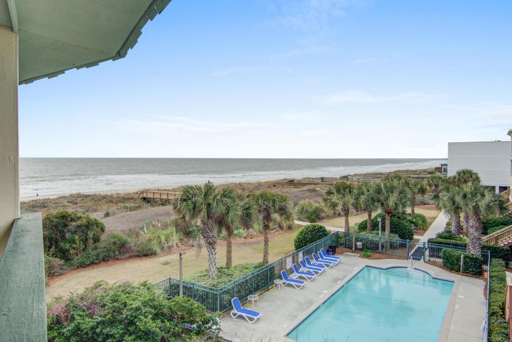 a view of the beach from the balcony of a resort at Sea Cabin 342-C in Isle of Palms